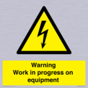warning-work-in-progress-on-equipmentwith-electrical-hazard-symbol~